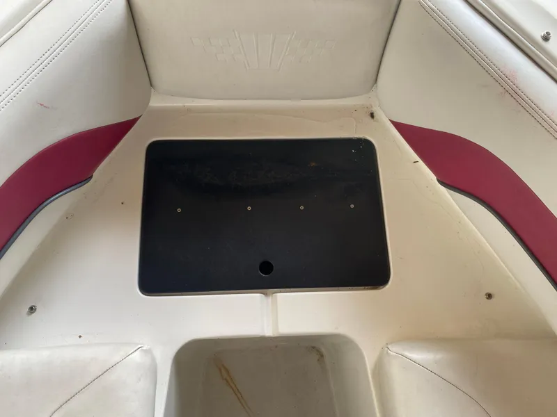 Slide: The Image of Interior of a 1995 Wellcraft 196 S Eclipse boat with red and white seating. - 11