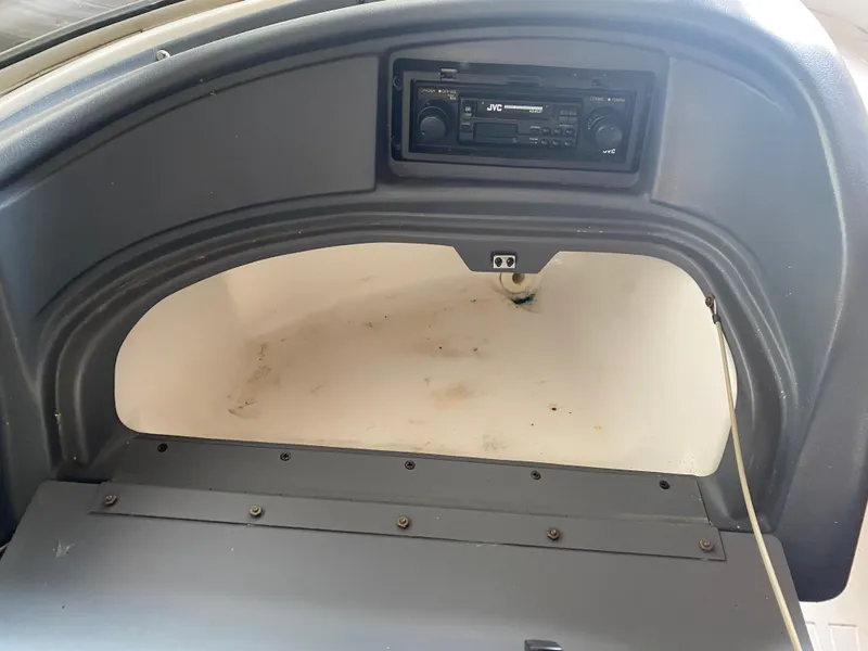 Slide: The Image of 1995 Wellcraft 196 S Eclipse boat dashboard with JVC stereo system. - 18