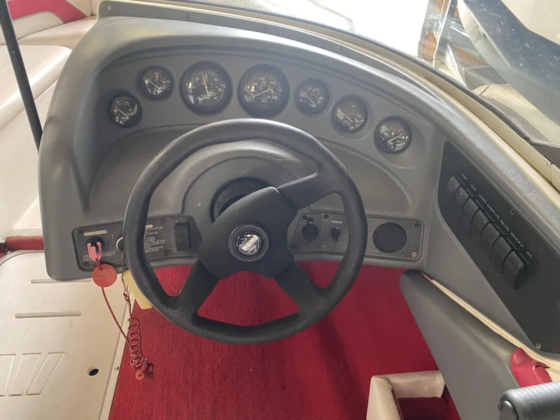 Slide: The Image of Dashboard of a 1995 Wellcraft 196 S Eclipse boat with steering wheel and gauges. - 19