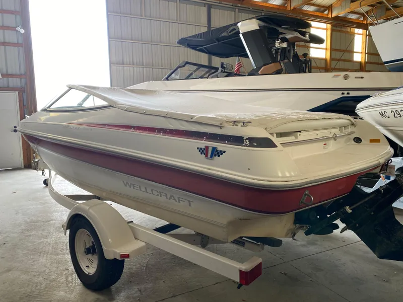 Slide: The Image of 1995 Wellcraft 196 S Eclipse boat on trailer in storage facility. - 2