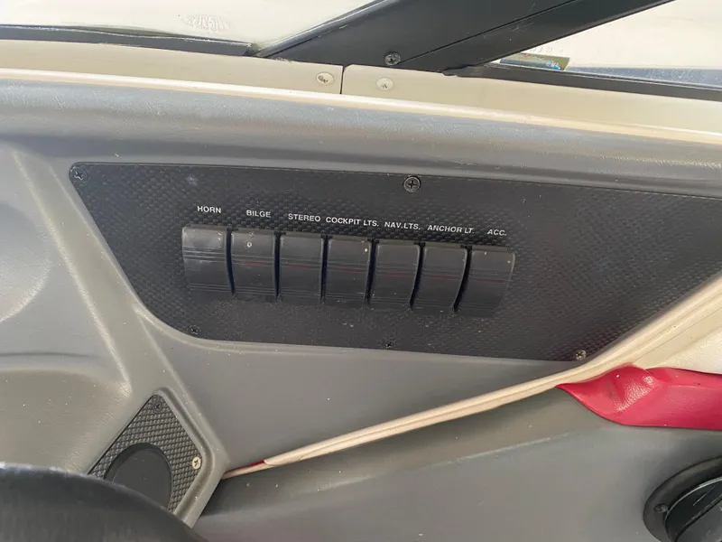Slide: The Image of Control panel of a 1995 Wellcraft 196 S Eclipse boat with labeled switches. - 20