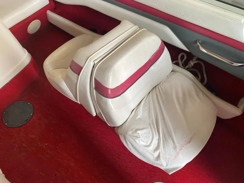 Slide: The Image of Interior of a 1995 Wellcraft 196 S Eclipse boat with red carpet and white seats. - 24