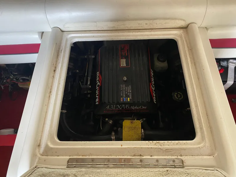 Slide: The Image of 1995 Wellcraft 196 S Eclipse engine compartment with visible MerCruiser components. - 30