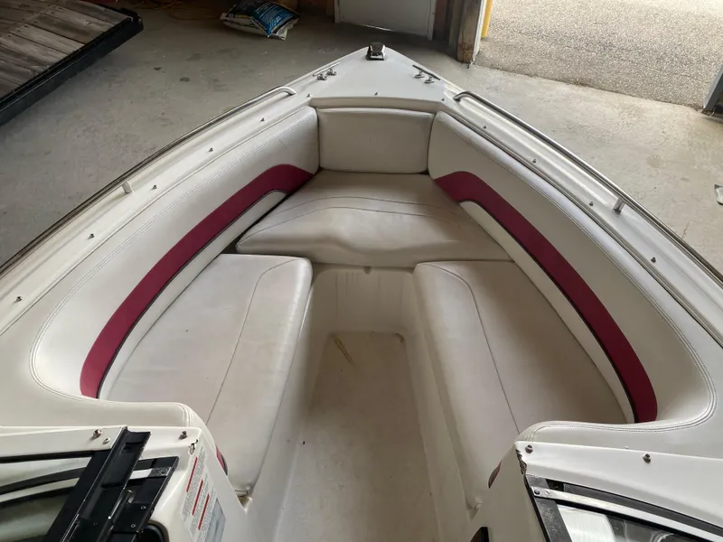 Slide: The Image of 1995 Wellcraft 196 S Eclipse boat interior with white and maroon seating. - 6