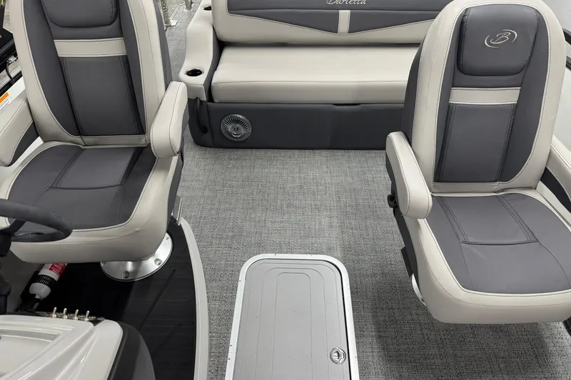 Slide: The Image of Interior of 2025 Barletta Cabrio 24UC pontoon boat with plush seating and modern design. - 16