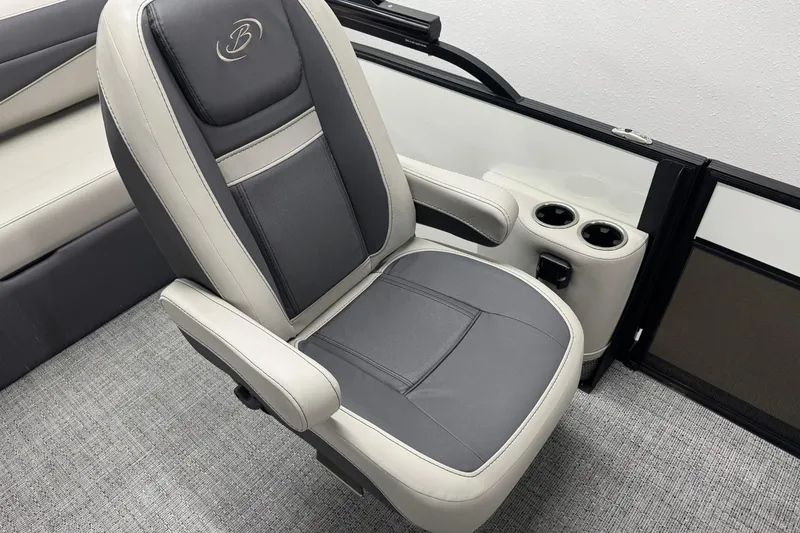 Slide: The Image of 2025 Barletta Cabrio 24UC boat seat with cup holders, featuring sleek gray and white design. - 17