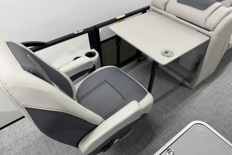 Slide: The Image of 2025 Barletta Cabrio 24UC interior with sleek seating and foldable table design. - 19