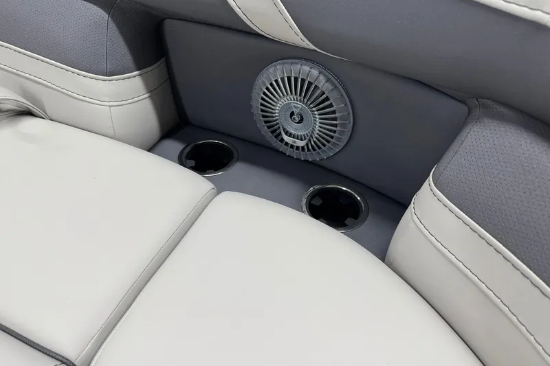 Slide: The Image of 2025 Barletta Cabrio 24UC interior with cup holders and speaker detail. - 24