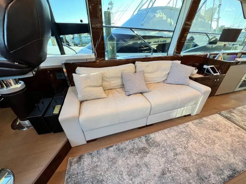 Slide: The Image of Luxurious interior of 2020 Fairline Squadron 68 yacht with elegant white sofa and cushions. - 10