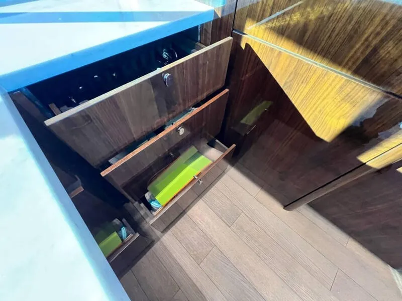 Slide: The Image of Luxury kitchen drawers in 2020 Fairline Squadron 68 yacht, featuring sleek wood finish. - 17