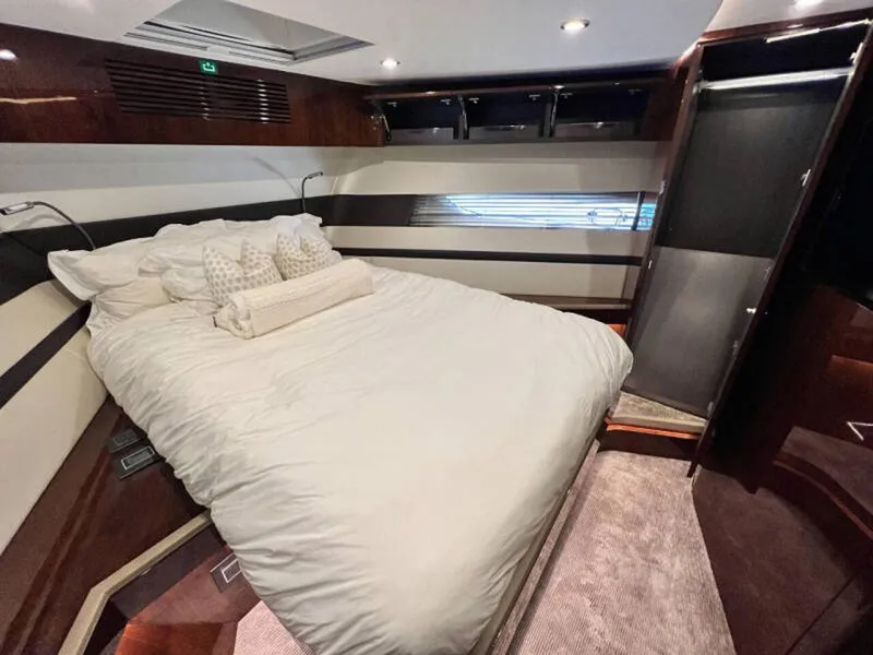 Slide: The Image of Luxurious bedroom interior of 2020 Fairline Squadron 68 yacht with elegant bedding. - 25