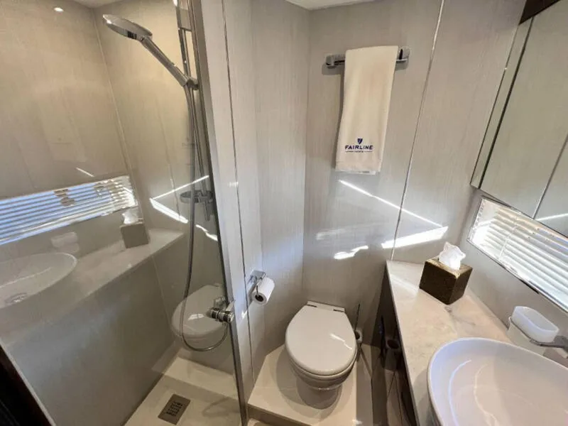 Slide: The Image of Bathroom interior of 2020 Fairline Squadron 68 yacht, featuring modern shower and amenities. - 38