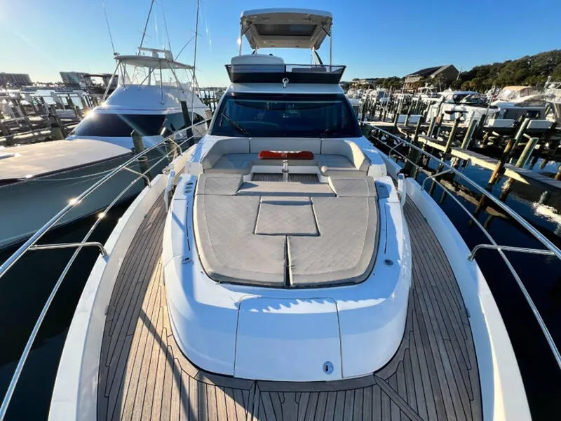 Slide: The Image of 2020 Fairline Squadron 68 yacht docked at marina, showcasing spacious deck and sleek design. - 4