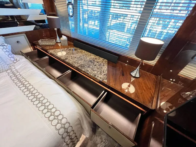 Slide: The Image of Luxurious interior of 2020 Fairline Squadron 68 yacht with elegant wood finish and ample storage. - 47