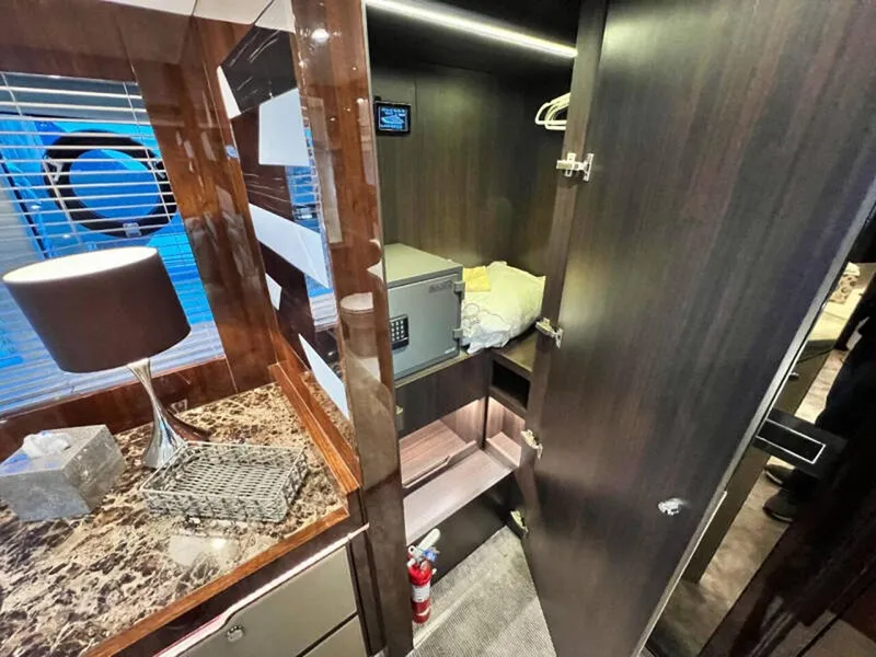 Slide: The Image of Luxurious interior of 2020 Fairline Squadron 68 yacht with closet and marble-topped dresser. - 48