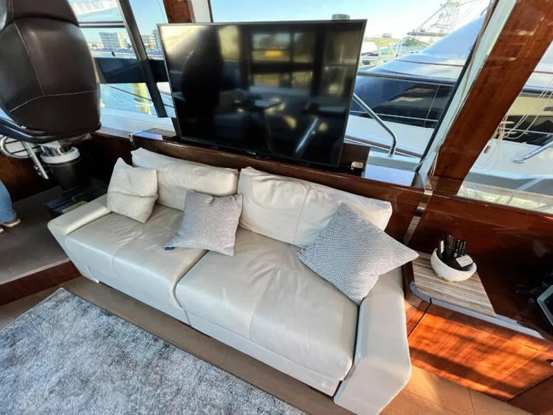 Slide: The Image of Luxurious interior of 2020 Fairline Squadron 68 yacht with leather sofa and large TV. - 7