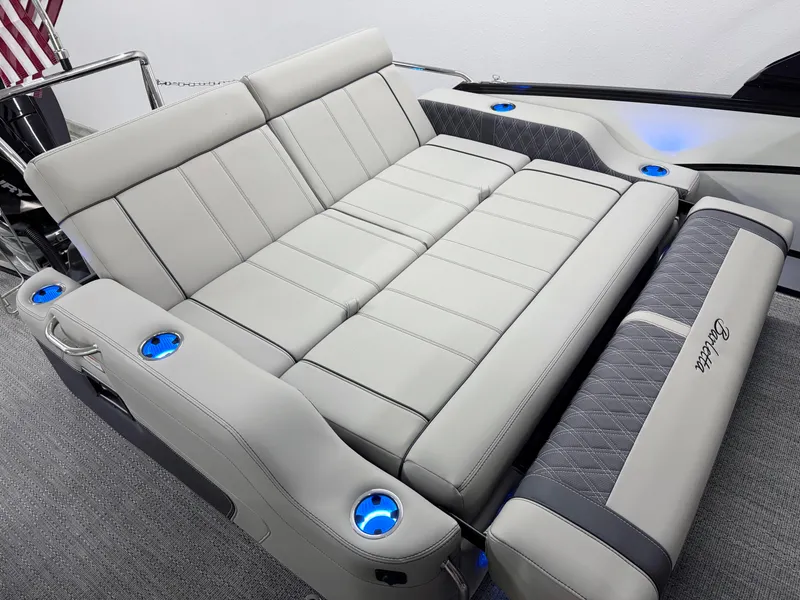 Slide: The Image of Luxurious seating on 2025 Barletta Lusso 25UC pontoon boat with cup holders and elegant design. - 11