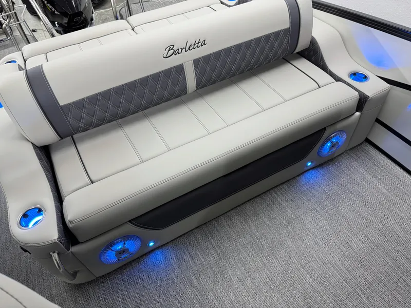 Slide: The Image of Luxurious seating on 2025 Barletta Lusso 25UC boat with blue LED lighting. - 17