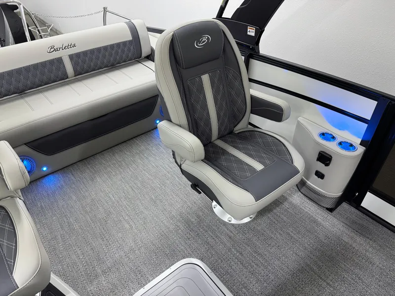 Slide: The Image of 2025 Barletta Lusso 25UC interior with luxurious seating and ambient lighting. - 18
