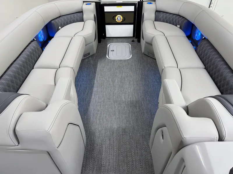 Slide: The Image of Luxurious interior of 2025 Barletta Lusso 25UC pontoon boat with plush seating and ambient lighting. - 27