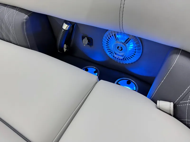 Slide: The Image of 2025 Barletta Lusso 25UC interior with blue LED lighting and cup holders. - 29