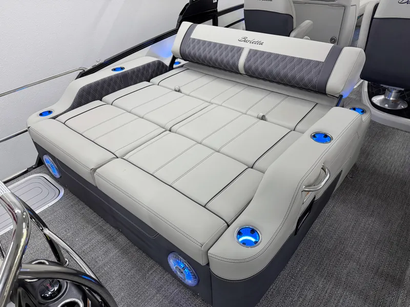 Slide: The Image of Luxurious seating on 2025 Barletta Lusso 25UC boat with cup holders and modern design. - 9