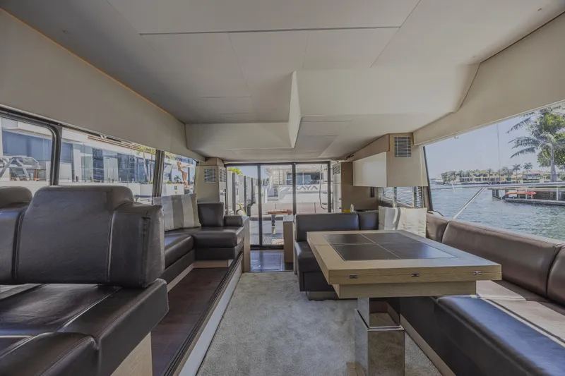 Slide: The Image of Luxurious interior of 2018 Prestige 520 yacht with elegant seating and dining area. - 19