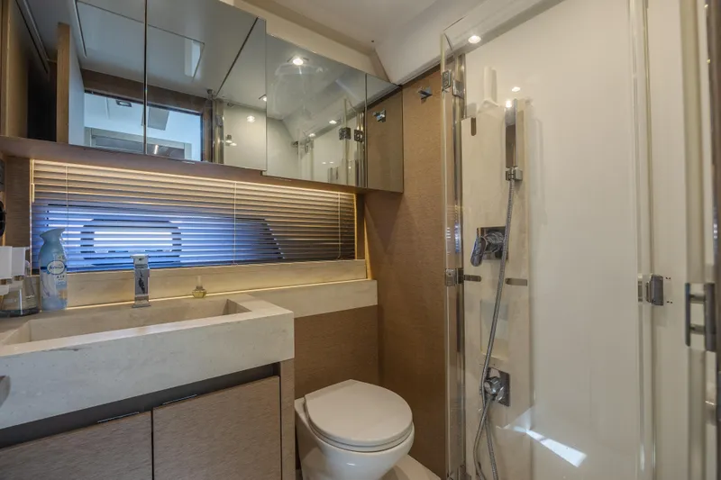 Slide: The Image of Luxurious bathroom in a 2018 Prestige 520 yacht with modern fixtures and elegant design. - 22