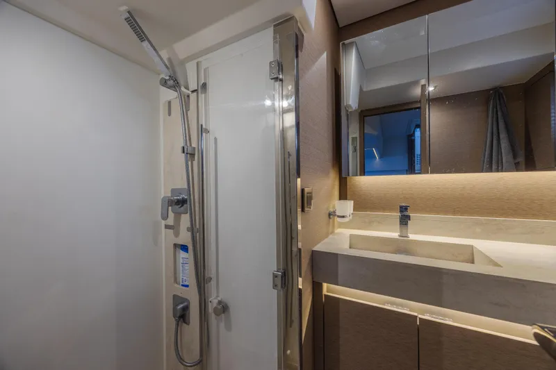 Slide: The Image of Luxurious bathroom in 2018 Prestige 520 yacht with modern shower and sleek vanity. - 26