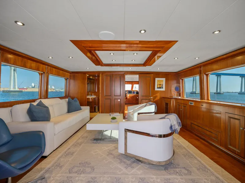 Slide: The Image of Luxurious yacht interior with elegant wood paneling, modern furniture, and ocean views. President Sterling 2010. - 17