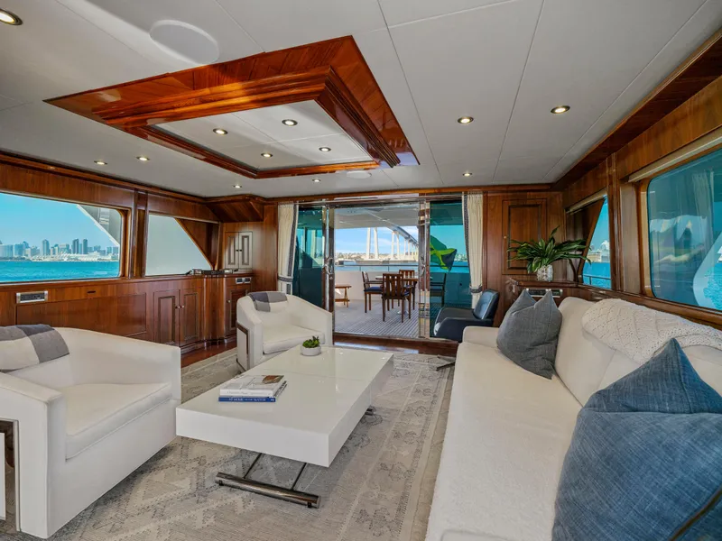 Slide: The Image of Luxurious yacht interior with modern decor, featuring a spacious lounge area and ocean views. President Sterling 2010. - 19