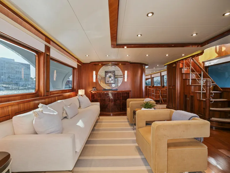 Slide: The Image of Luxurious yacht interior with elegant seating, wooden accents, and modern decor, President Sterling 2010 model. - 31