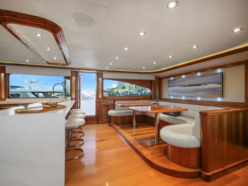 Slide: The Image of Luxurious yacht interior with wooden accents, modern seating, and large windows, President Sterling 2010 model. - 41