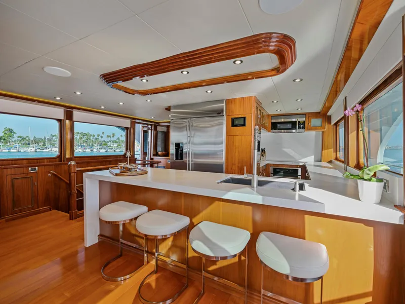 Slide: The Image of Luxurious yacht kitchen interior with modern appliances, wooden accents, and ocean view. President Sterling 2010. - 43