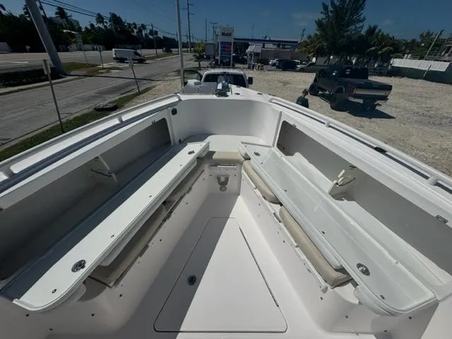 Slide: The Image of 2015 Everglades 295 Center Console boat interior with seating and storage compartments. - 10