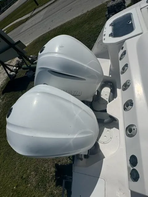 Slide: The Image of 2015 Everglades 295 Center Console boat with dual outboard engines. - 11