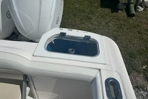 Slide: The Image of 2015 Everglades 295 Center Console boat with livewell and seating area. - 14
