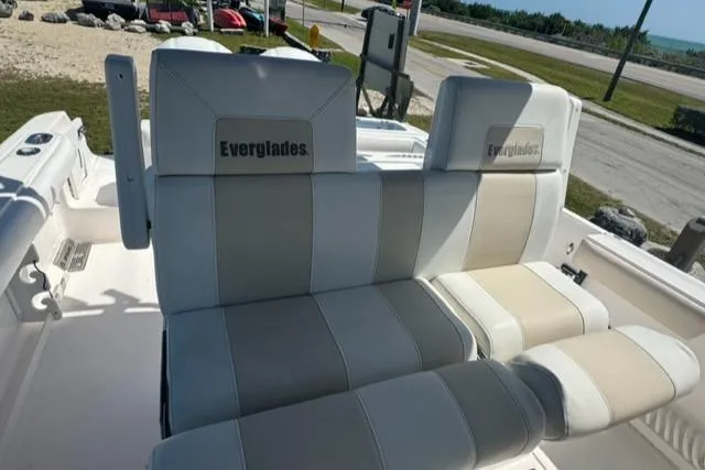Slide: The Image of 2015 Everglades 295 Center Console boat seating, featuring cushioned seats with Everglades branding. - 15