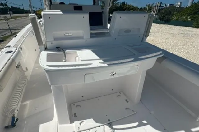 Slide: The Image of 2015 Everglades 295 Center Console boat interior with white deck and console. - 19