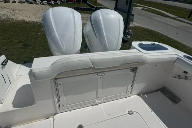 Slide: The Image of 2015 Everglades 295 Center Console boat with dual outboard engines, white interior. - 22