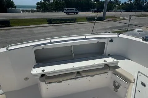 Slide: The Image of 2015 Everglades 295 Center Console boat interior with seating and storage. - 24