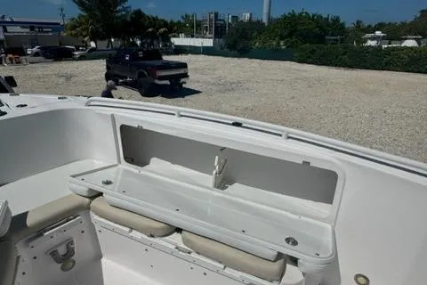 Slide: The Image of 2015 Everglades 295 Center Console boat interior with seating and storage. - 25