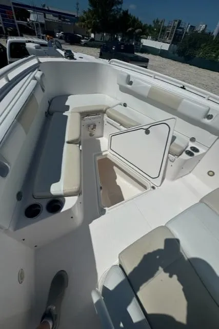 Slide: The Image of 2015 Everglades 295 Center Console boat interior with open storage compartment. - 26