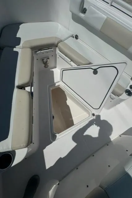 Slide: The Image of 2015 Everglades 295 Center Console boat interior with open storage compartment. - 27