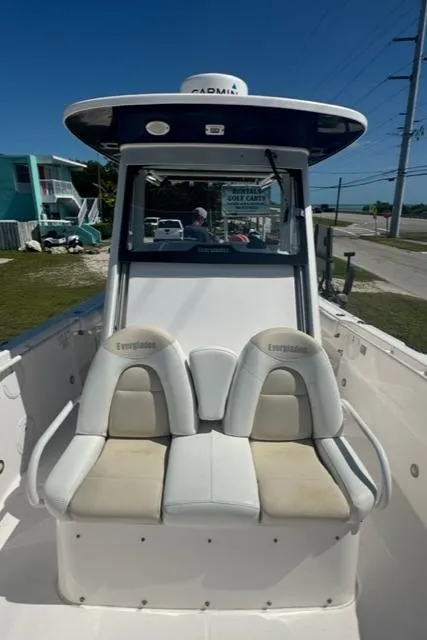 Slide: The Image of 2015 Everglades 295 Center Console boat with dual seats and modern design. - 28