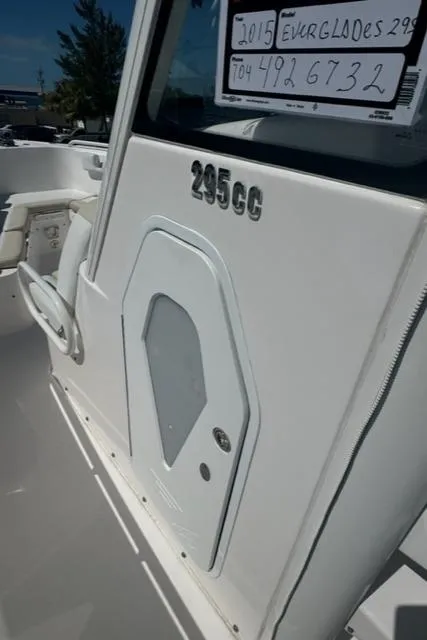 Slide: The Image of 2015 Everglades 295 Center Console boat, white exterior, side view. - 35