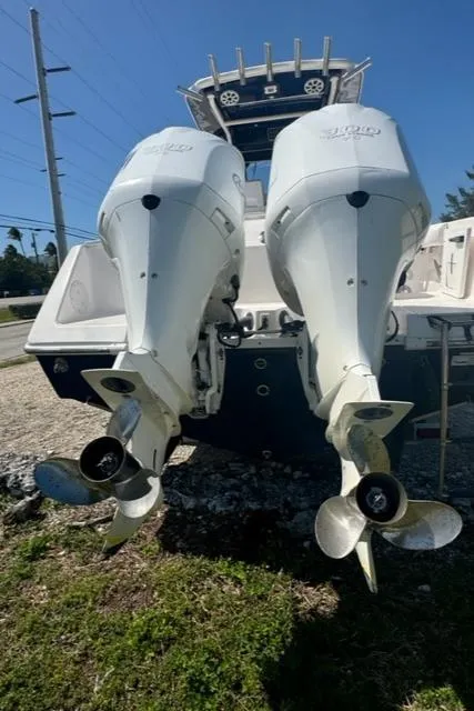 Slide: The Image of 2015 Everglades 295 Center Console with dual outboard engines, rear view. - 37