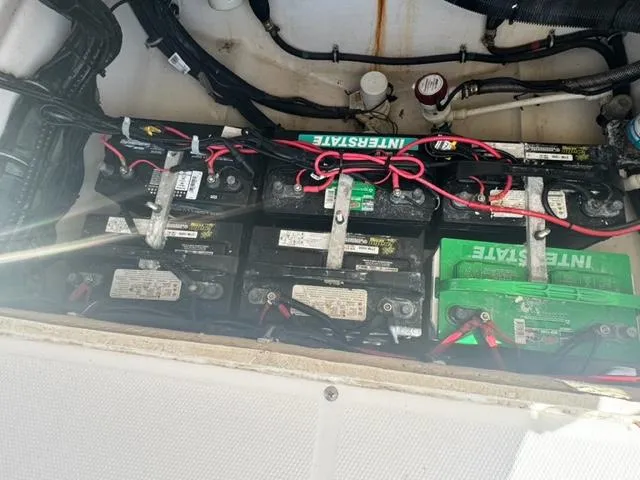 Slide: The Image of Battery compartment of a 2015 Everglades 295 Center Console boat with multiple Interstate batteries. - 47