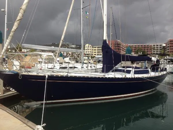 Slide: The Image of Sailboat docked in marina, Columbia Cutter 1993, under cloudy skies. - 2