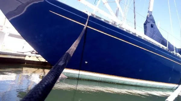 Slide: The Image of Blue 1993 Columbia Cutter sailboat docked in marina, side view. - 20